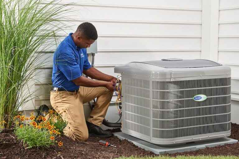 Technician servicing an AC system